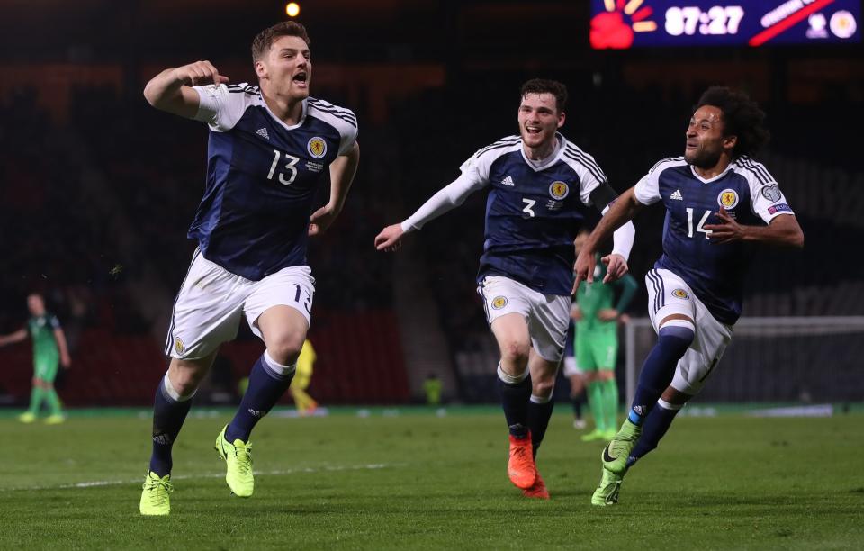 <p>Scotland’s Chris Martin celebrates bagging the winner against Slovenia </p>