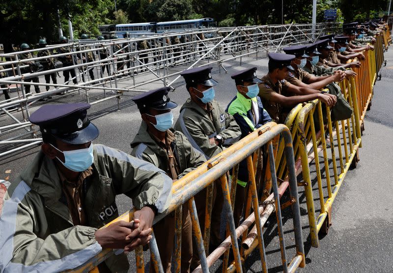 Security personel patrol in the premises of Sri Lanka's Parliament building, in Colombo