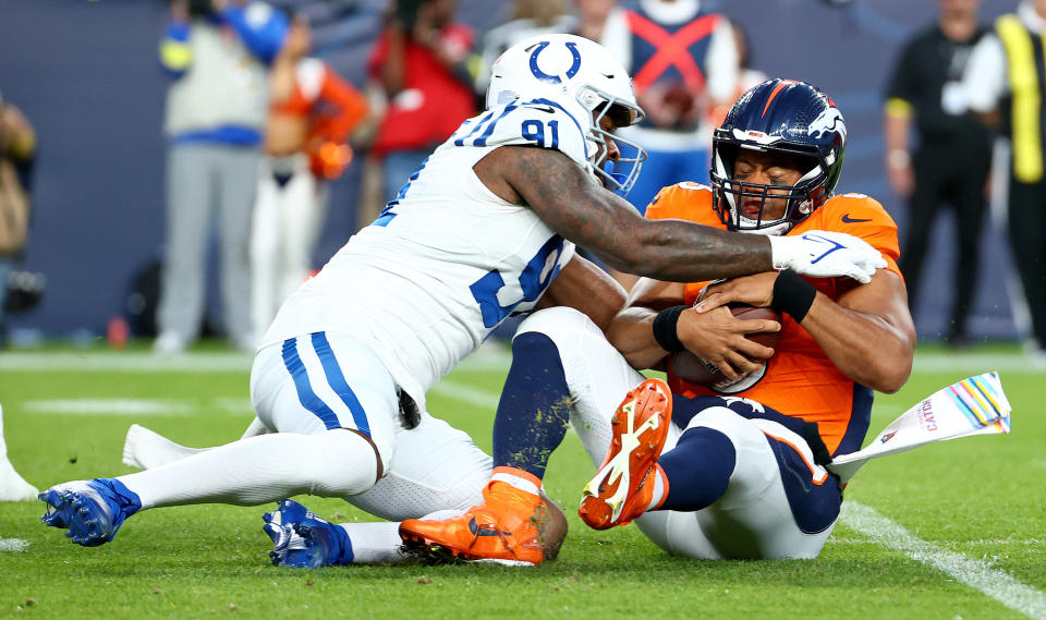 Russell Wilson had a rough night for the Broncos in a 12-9 loss. (Photo by Justin Tafoya/Getty Images)