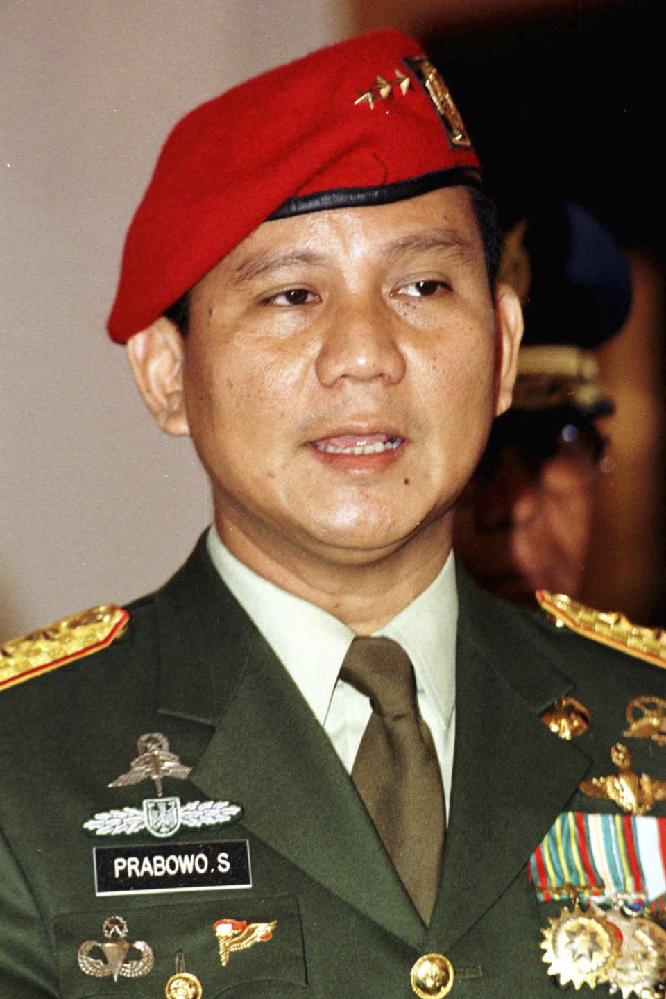 FILE - Lt. Gen. Prabowo Subianto, the commander of the Army Strategic Reserve Command (KOSTRAD) is pictured at his installation ceremony in Jakarta, Feb. 16, 1998. Defense Minister Subianto, a wealthy ex-general with ties to both Indonesia’s popular outgoing president and its dictatorial past looks set to be its next president, after unofficial tallies showed him taking a clear majority in the first round of voting. (AP Photo/Muchtar Zakaria, File)