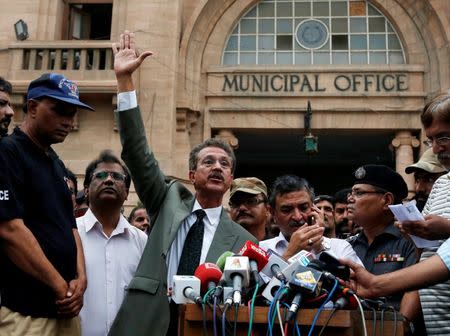 Waseem Akhtar, mayor nominee of Muttahida Qaumi Movement (MQM) political party, gestures while speaking to members of the media (unseen) after the ballot for mayor outside the Municipal Corporation Building in Karachi, Pakistan, August 24, 2016. REUTERS/Akhtar Soomro