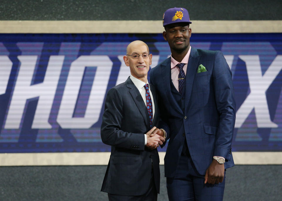 Deandre Ayton greets NBA commissioner Adam Silver after being selected as the No. 1 overall pick to the Phoenix Suns at the 2018 NBA draft. (Brad Penner/USA TODAY Sports)