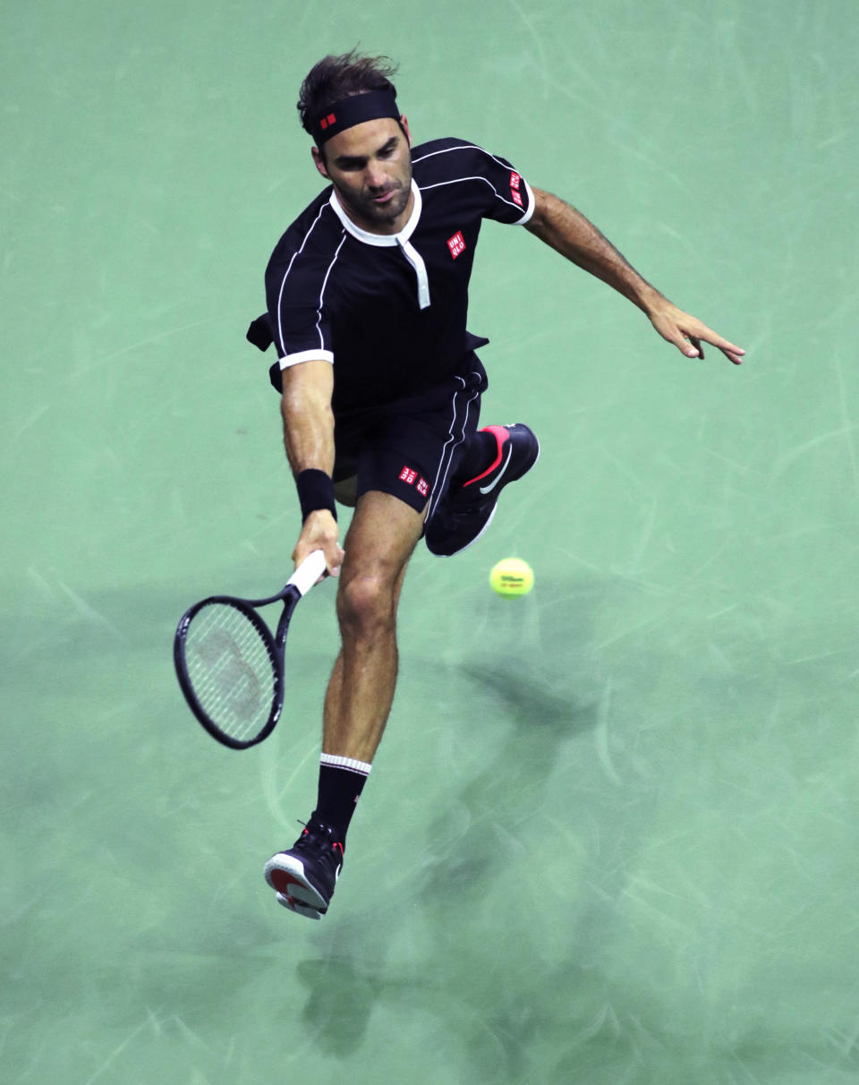 Roger Federer returns to Sumit Nagal during the first round of the U.S. Open tennis tournament in New York, Monday, Aug. 26, 2019. (AP Photo/Charles Krupa)