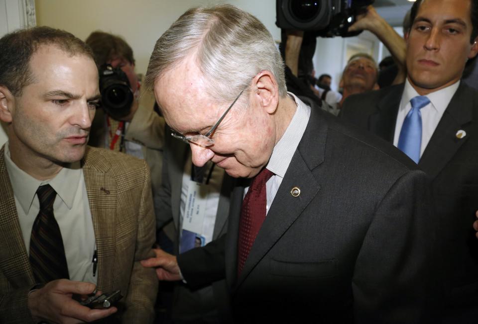 U.S. Senate Majority Leader Reid departs after a news conference in Washington