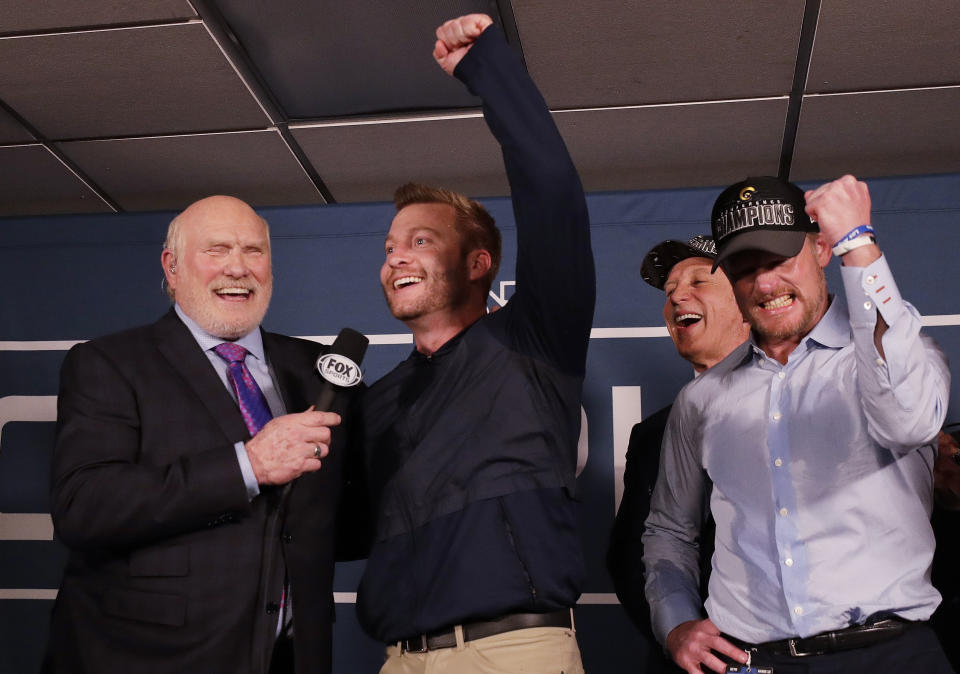Los Angeles Rams head coach Sean McVay reacts in the locker room with broadcaster Terry Bradshaw after overtime of the NFL football NFC championship game against the New Orleans Saints, Sunday, Jan. 20, 2019, in New Orleans. The Rams won 26-23. (AP Photo/David J. Phillip)