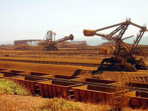 File photo taken in 2010 shows iron ore carriers at Rio Tinto's Dampier port in Western Australia. Australian PM Julia Gillard Tuesday denied claims that the mining boom was over, saying its benefits would last decades even as a key forecaster warned more projects may be shelved