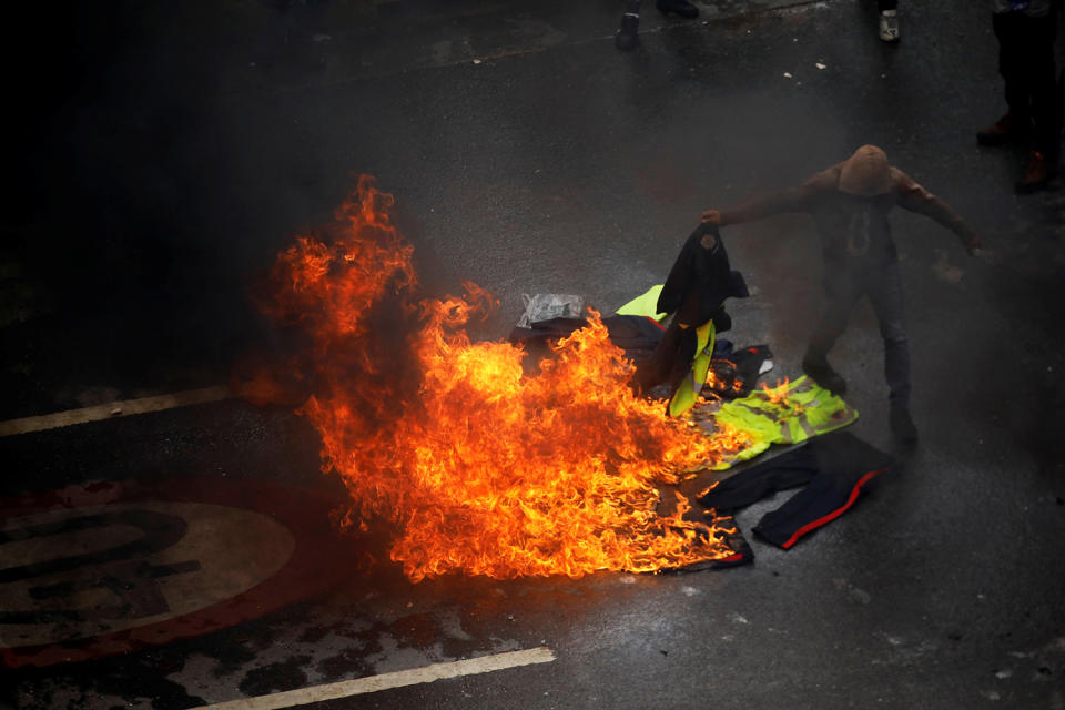 <p>Demonstrators burn police uniforms as clashes broke out with security forces while the Constituent Assembly election was being carried out in Caracas, Venezuela, July 30, 2017. (Carlos Garcia Rawlins/Reuters) </p>