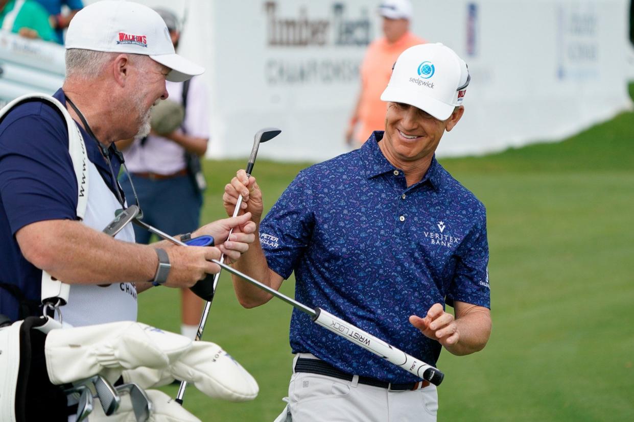 Co-leader David Toms and his caddie react to a well-executed chip shot during the opening round of the TimberTech Championship at The Old Course at Broken Sound on Friday, November 3, 2023, in Boca Raton, FL.
