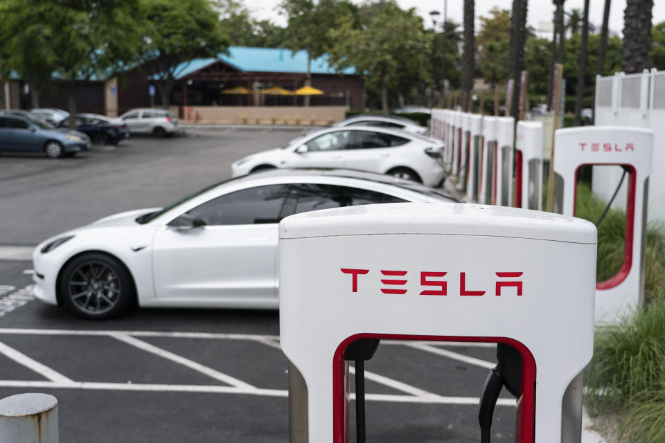 Tesla electric vehicles are charged at a charging station in Anaheim, Calif., Friday, June 9, 2023. Owners of General Motors and Ford electric vehicles will be able charge at many of Tesla's large network of stations across the U.S. starting next year. (AP Photo/Jae C. Hong)