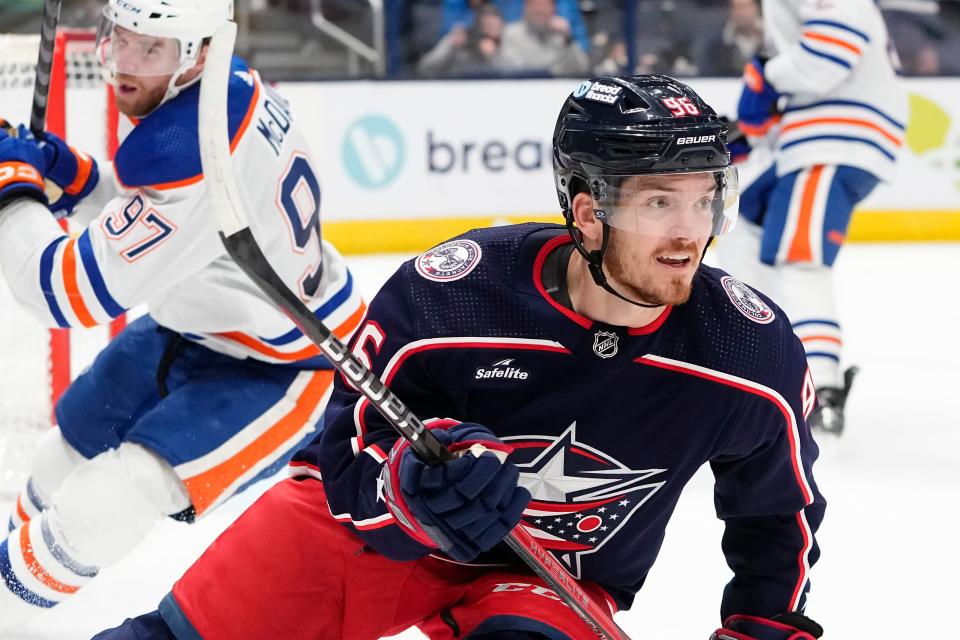 Mar 7, 2024; Columbus, Ohio, USA; Columbus Blue Jackets center Jack Roslovic (96) celebrates scoring an empty net goal during the third period of the NHL hockey game against the Edmonton Oilers at Nationwide Arena. The Blue Jackets won 4-2.