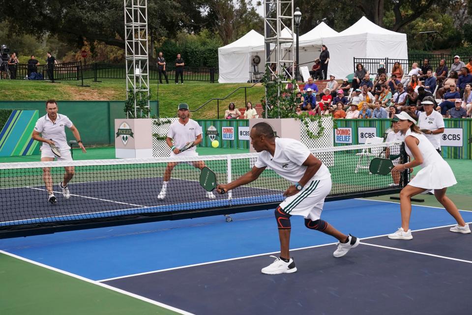 CBS puts the spotlight on the booming sport of pickleball in "Pickled," a two-hour celebrity tournament hosted by Stephen Colbert. Among the 16 players are those pictured here: (from left to right) Phil Keoghan, Dierks Bentley, Sugar Ray Leonard and Emma Watson.