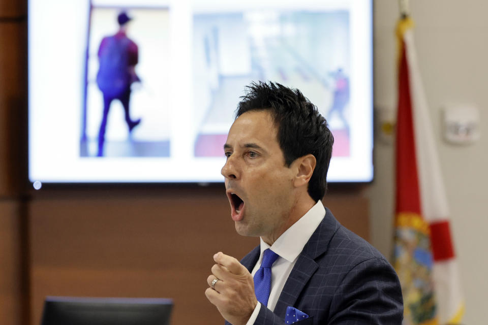 With photos of the shooter displayed on a courtroom monitor, defense attorney Mark Eiglarsh gives his opening statement statements in the case of former Marjory Stoneman Douglas High School School Resource Officer Scot Peterson at the Broward County Courthouse in Fort Lauderdale on Wednesday, June 7, 2023. (Amy Beth Bennett/South Florida Sun-Sentinel via AP, Pool)