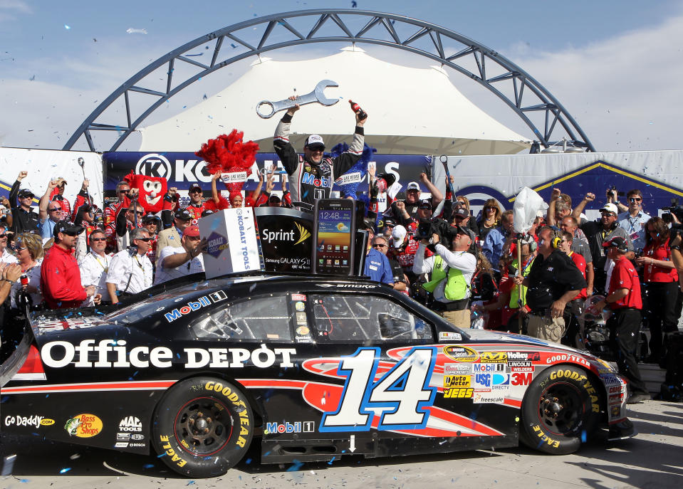 LAS VEGAS, NV - MARCH 11: Tony Stewart, driver of the #14 Mobil 1/Office Depot Chevrolet, celebrates in Victory Lane after winning the NASCAR Sprint Cup Series Kobalt Tools 400 at Las Vegas Motor Speedway on March 11, 2012 in Las Vegas, Nevada. (Photo by Jeff Bottari/Getty Images for NASCAR)