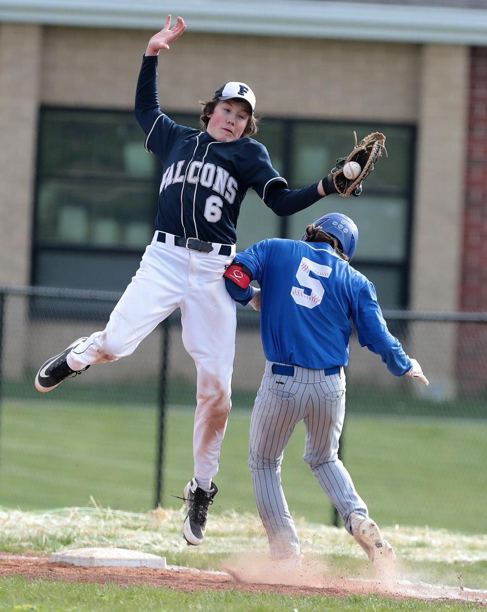 Tuslaw's Preston Hawk (5) beats a throw to Fairless first baseman Luke Buchanan for a single during Wednesday's game.