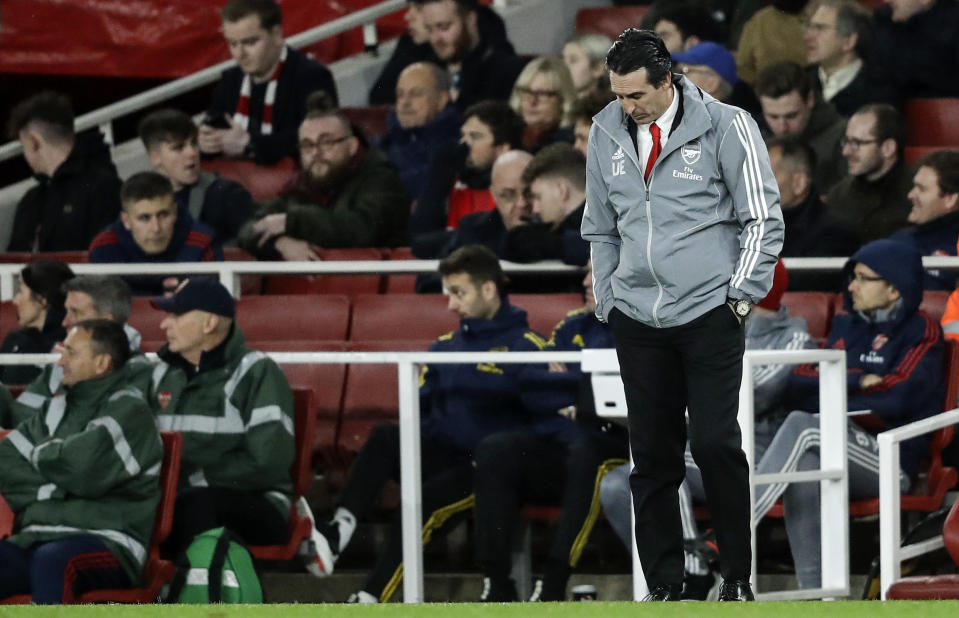 Arsenal's head coach Unai Emery reacts during the Europa League Group F soccer match between Arsenal and Eintracht Frankfurt at the Emirates Stadium, in London, Thursday, Nov. 28, 2019. (AP Photo/Matt Dunham)