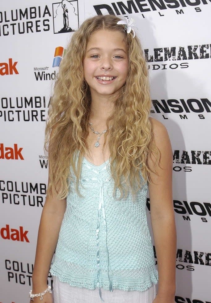 closeup of her with wavy blonde hair at an event