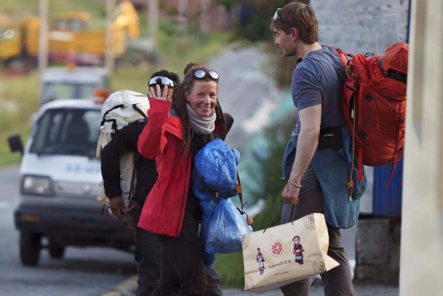 Norwegian climber Kristin Harila, 37, left, waves after arriving in Kathmandu, Nepal, Thursday, May 4, 2023. Harila who just became the fastest female climber to scale the 14 highest mountains in the world is now aiming to become the fastest person to complete the feat, beating a record set by a male climber in 2019. (AP Photo/Niranjan Shrestha)