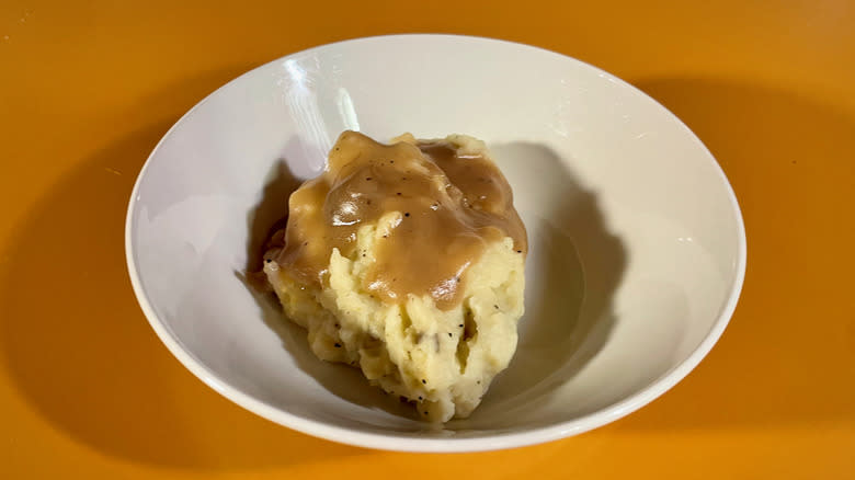 bowl of mashed potatoes with gravy