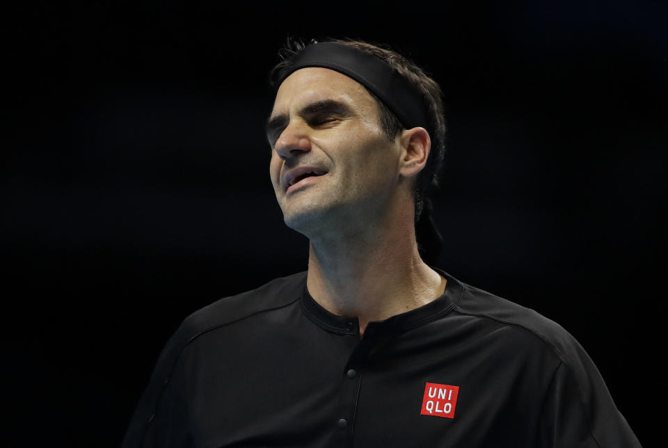 Roger Federer of Switzerland reacts after losing a point against Stefanos Tsitsipas of Greece during their ATP World Tour Finals semifinal tennis match at the O2 Arena in London, Saturday, Nov. 16, 2019. (AP Photo/Kirsty Wigglesworth)