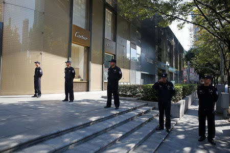 Policemen stand guard on a blocked road near the Museum of the First National Congress of the Chinese Communist Party, as China's President Xi Jinping visits the museum, in Shanghai, China, October 31, 2017. REUTERS/Aly Song