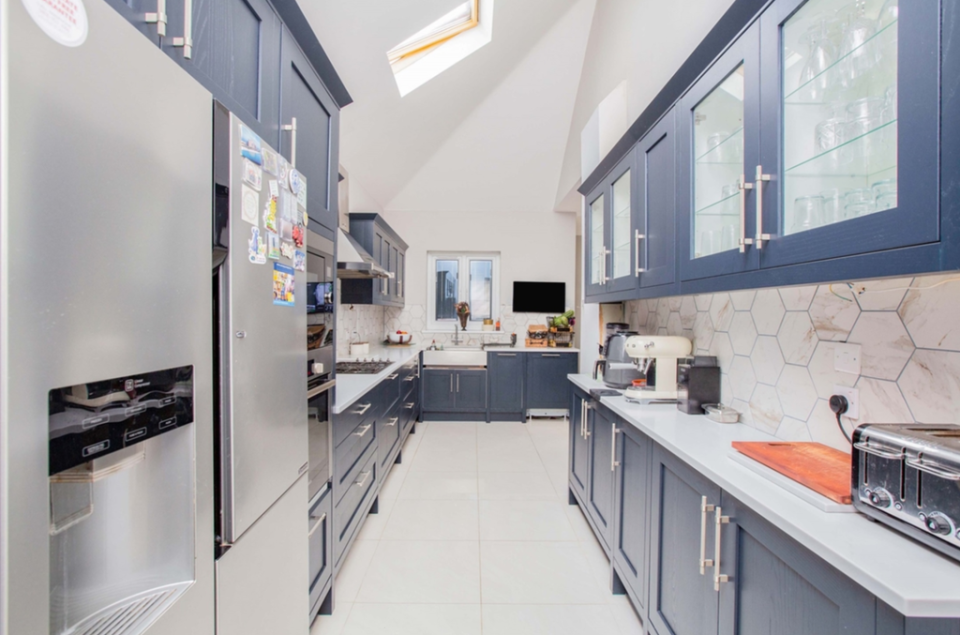 The ink blue galley kitchen in the most expensive home in Barking (William H Brown)