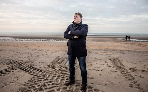 Bram Degrieck, Mayor of De Panne, stood on the beach on the Belgium coast where the first smugglers boat carrying immigrants was seized this week - Credit: Jeff Gilbert