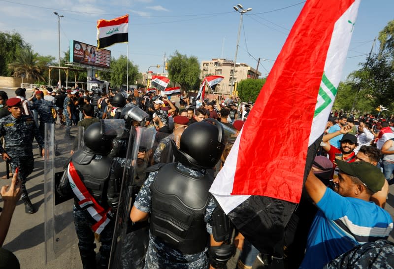 Iraqi security forces are seen during a protest over corruption, lack of jobs, and poor services, in Baghdad