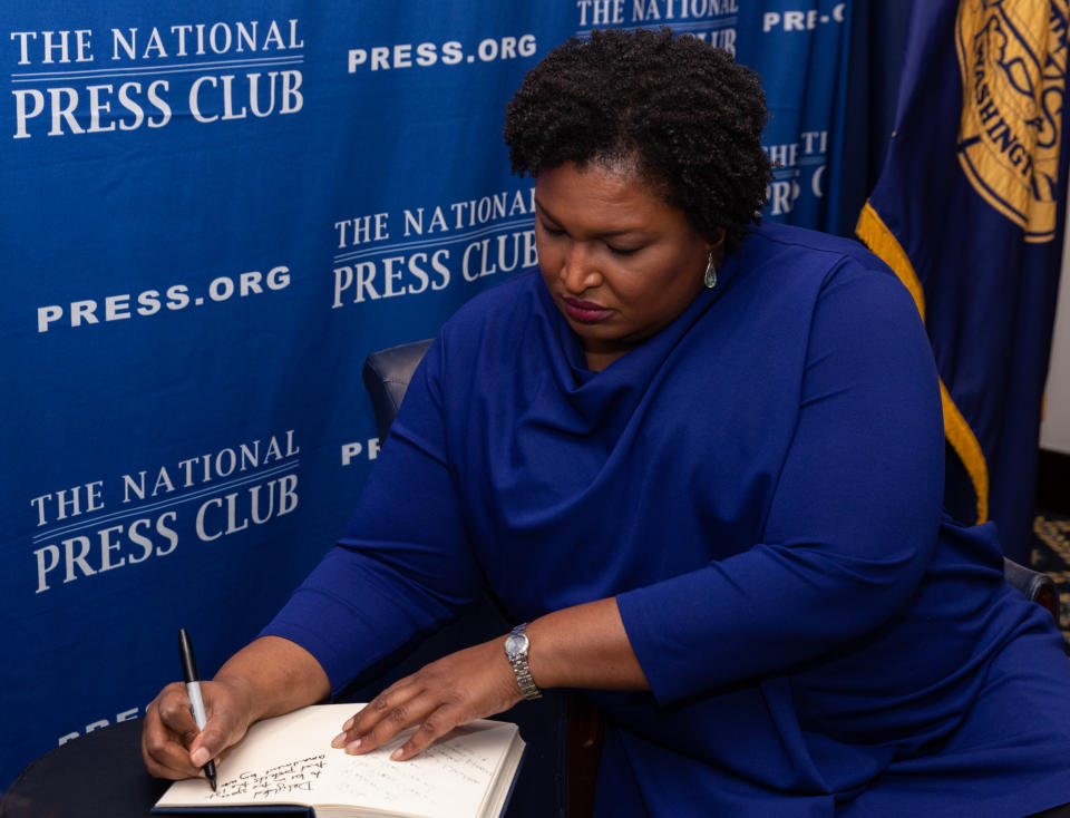 Stacey Abrams, former Georgia House Democratic Leader, signs the National Press Club (NPC) guest book, before speaking at the NPC Headliners Luncheon in Washington, D.C., on Friday, November 15, 2019.(Photo by Cheriss May/NurPhoto via Getty Images)