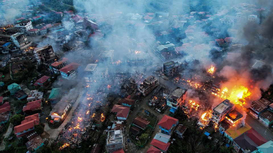This aerial photo taken on October 29, 2021 show smokes and fires from Thantlang, in Chin State, where buildings were destroyed by shelling from junta troops, according to local media. - Stringer/AFP/Getty Images