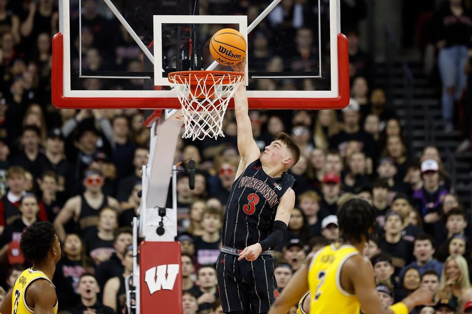 Wisconsin's Connor Essegian scores on a slam dunk during the first half on Tuesday, Feb. 14, 2023, in Madison, Wisconsin.