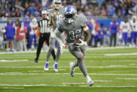 Detroit Lions running back D'Andre Swift runs into the end zone for a two-point conversion during the second half of an NFL football game against the Buffalo Bills, Thursday, Nov. 24, 2022, in Detroit. (AP Photo/Paul Sancya)