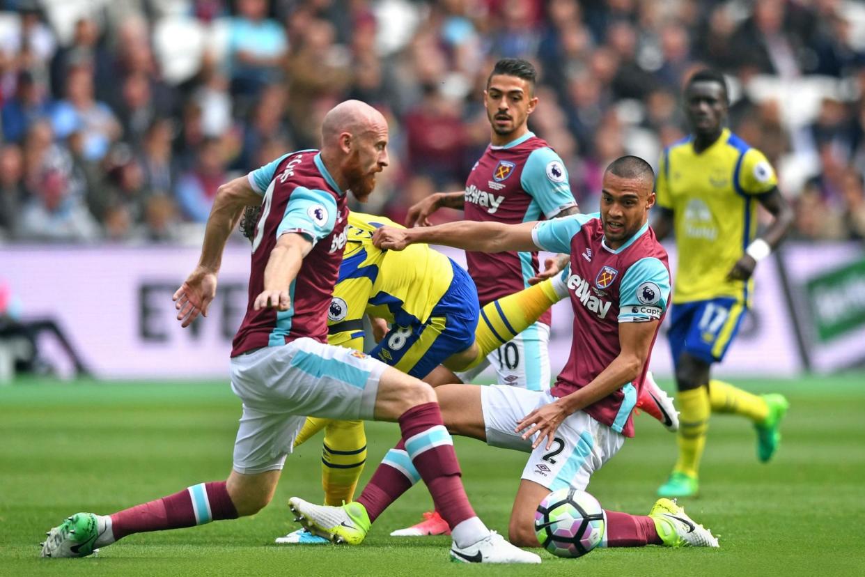 Digging in: James Tomkins and Winston Reid show the commitment Slaven Bilic has called for: Simon West/Action Plus via Getty Images