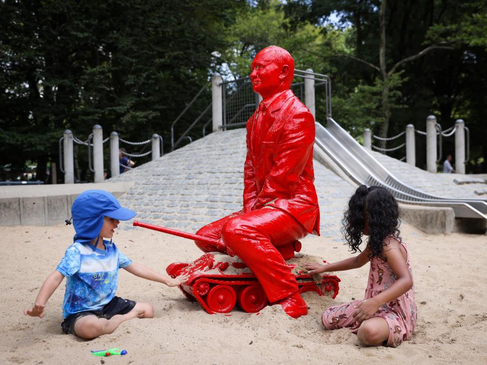 Children play by a statue of Russian President Vladimir Putin riding a tank created by French artist James Colomina in Central Park in Manhattan, New York City, U.S., August 2, 2022.