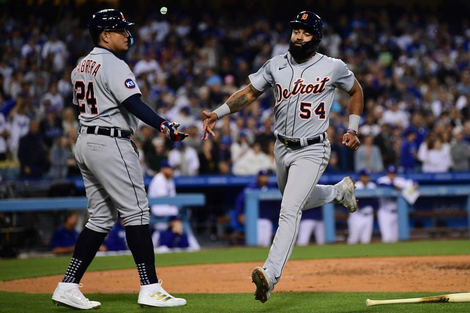 Detroit Tigers center fielder Derek Hill (54) is greeted by designated hitter Miguel Cabrera (24) after scoring a run against the Los Angeles Dodgers during the third inning  on Saturday, April 30, 2022, at Dodger Stadium in Los Angeles.