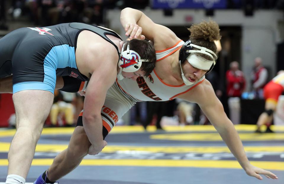 Aidan Mozden of Alliance takes down Mekhi Bradley of Mansfield during their 215-pound Division II quarterfinal match in the OHSAA State Wrestling Tournament at the Jerome Schottenstein Center, Saturday, March 11, 2023, in Columbus, Ohio.