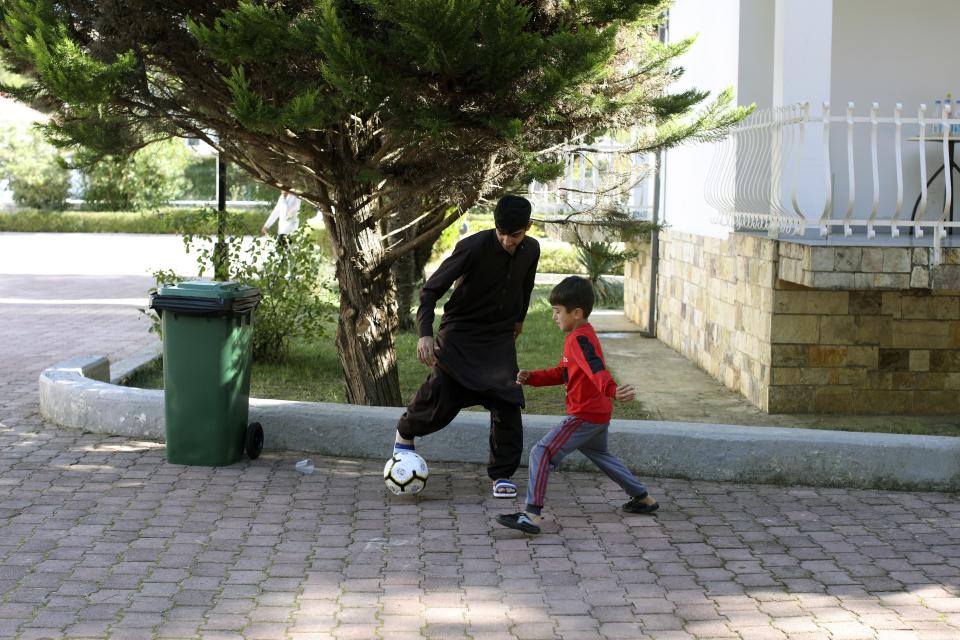 Afghan children play at a coastline tourist resort in Golem, 50 kilometers (30 miles) west of Tirana, Albania, Wednesday, Oct. 27, 2021. A group of Afghans evacuated earlier this month are housed at an Albanian coastline tourist resort enjoying the warm welcome and a normal daily life. The last group of judges, sportsmen, journalists, activists, artists, law enforcement officers, scientists and more arrived earlier in October. They all miss and fear of the fate of their families back home. (AP Photo/Franc Zhurda)