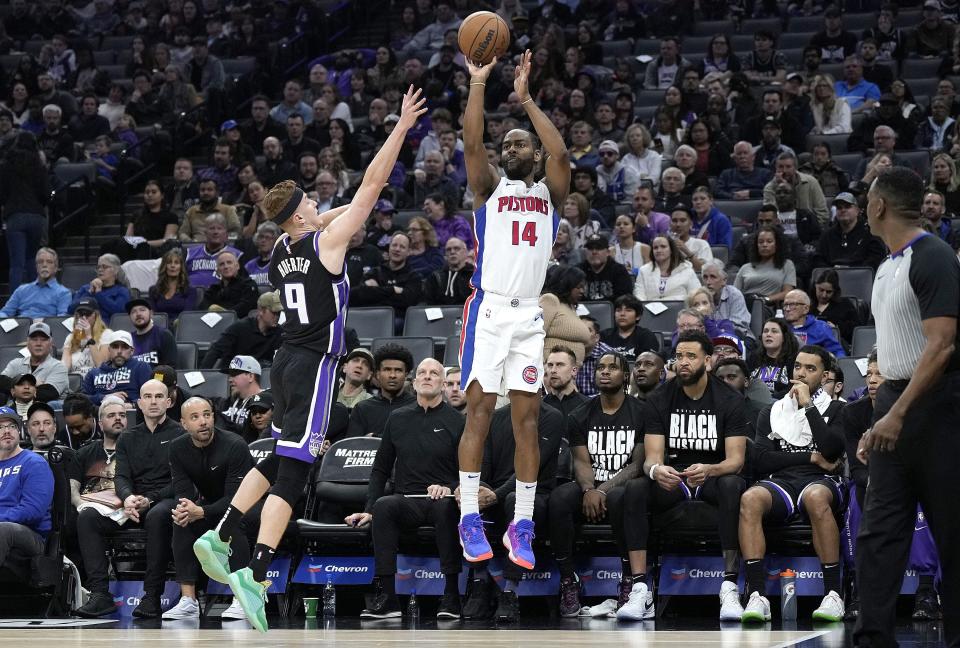 Pistons guard Alec Burks shoots a 3-pointer against Kings guard Kevin Huerter in the second quarter on Wednesday, Feb. 7, 2024, in Sacramento, California.