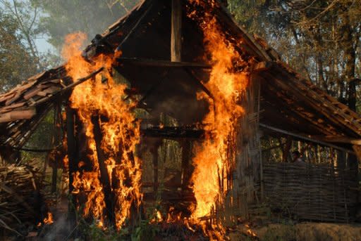 A burning house in Sampang, East Java, on August 26. A mob attack on Shiites in Indonesia saw two men killed with sickles and dozens of homes torched, police and a human rights group said Monday, in the latest sign of rising intolerance in the world's largest Muslim country