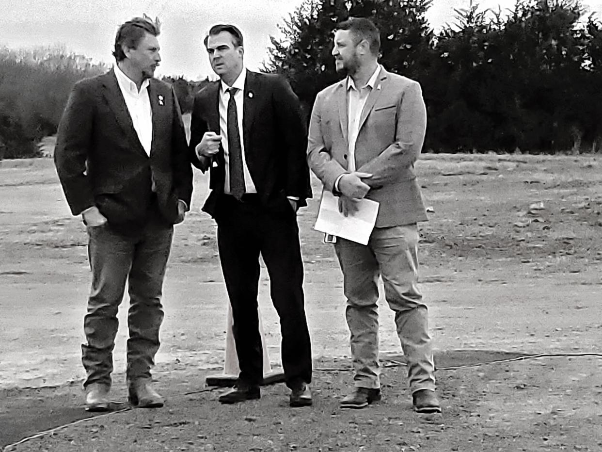 Former Secretary of Transportation Tim Gatz visits with Gov. Kevin Stitt and turnpike authority deputy director Joe Echelle during a groundbreaking Thursday for widening of the Turner Turnpike, the first ACCESS Oklahoma project.