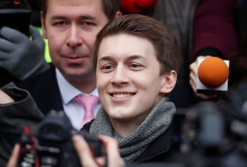 Russian protester Zhukov reacts after a court hearing in Moscow