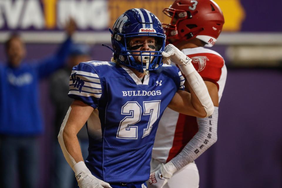 Van Meter wide receiver Carter Durflinger (27) celebrates a touchdown during the Class 1A state championship game