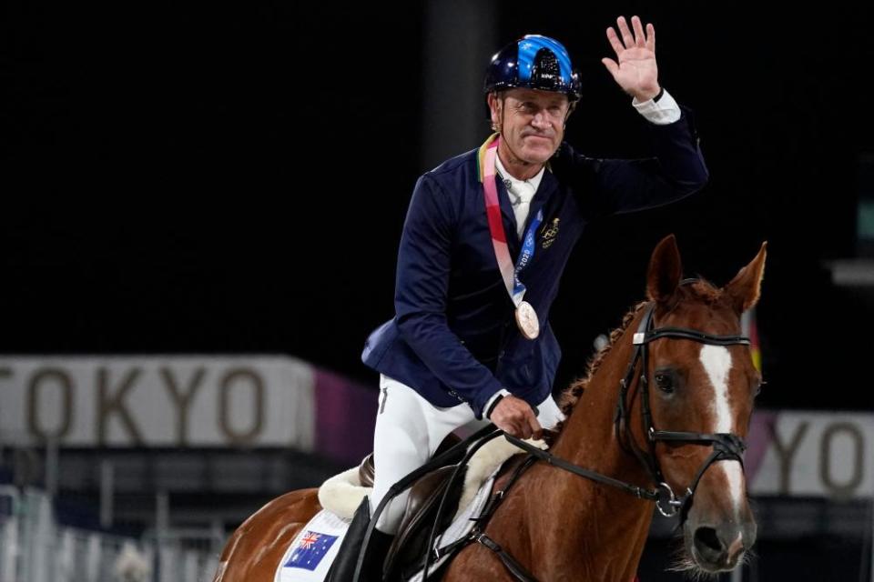 Australia’s Andrew Hoy rides in the ring after receiving his bronze medal.