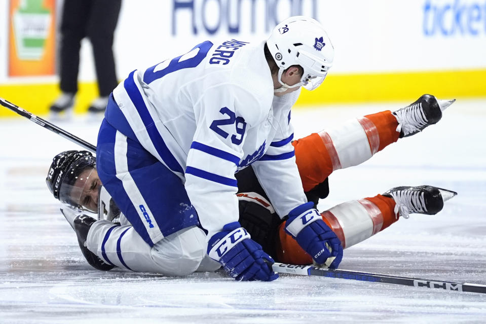 Toronto Maple Leafs' Pontus Holmberg (29) collides with Philadelphia Flyers' Garnet Hathaway (19) during the third period of an NHL hockey game, Thursday, March 14, 2024, in Philadelphia. (AP Photo/Matt Slocum)
