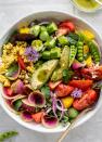 <p>As if the crunchy in-season produce isn’t enough, the mint vinaigrette makes it clear that this salad is meant to be consumed while relaxing under the summer sun.</p> <p>Get the recipe <a href="https://www.howsweeteats.com/2020/06/loaded-summer-house-salad/" rel="nofollow noopener" target="_blank" data-ylk="slk:here;elm:context_link;itc:0;sec:content-canvas" class="link ">here</a>.</p>