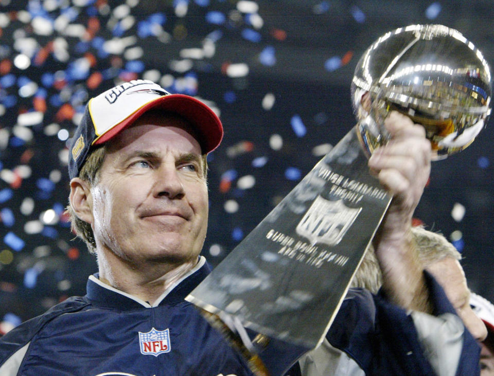 Bill Belichick holds the Vince Lombardi trophy. (Jeff Haynes / AFP - Getty Images file)