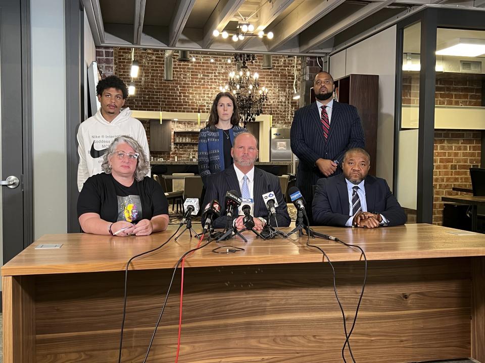 The legal team representing the family of Donovan Lewis address the media on Friday, Aug. 4, 2023, in Columbus, Ohio, after a grand jury indicted former officer Ricky Anderson in the fatal shooting of 20-year-old Donovan Lewis. From bottom left, Rebecca Duran, mother of Donovan Lewis, attorneys representing Lewis' family, Rex Elliott, and Michael Wright, and top right, Robert Gresham, and Kaela King, and Lewis' brother Tariq Stewart. (AP Photo/Patrick Orsagos)