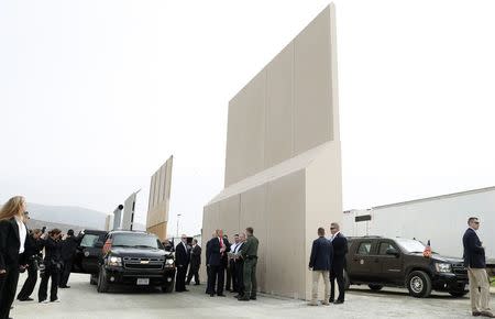 U.S. President Donald Trump participates in a tour of U.S.-Mexico border wall prototypes near the Otay Mesa Port of Entry in San Diego, California. U.S., March 13, 2018. REUTERS/Kevin Lamarque