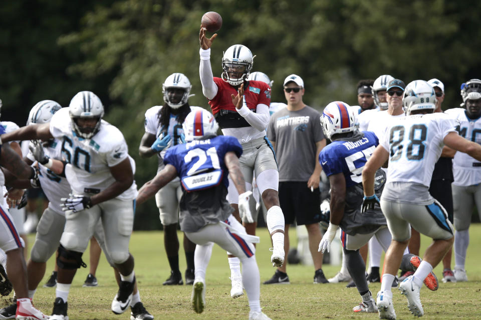 Carolina Panthers quarterback Cam Newton passes against the Buffalo Bills during an NFL football training camp in Spartanburg, S.C., Wednesday, Aug. 14, 2019. (AP Photo/Gerry Broome)