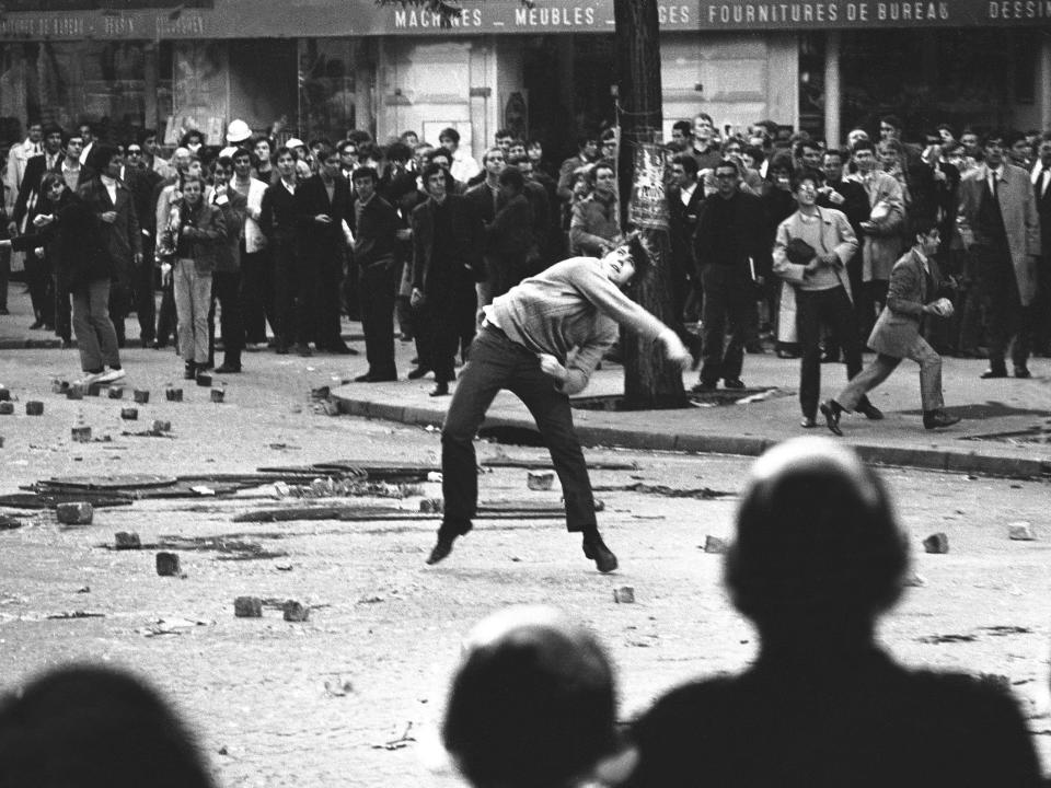 A student attacking the police in Paris during the May 1968 student uprising.