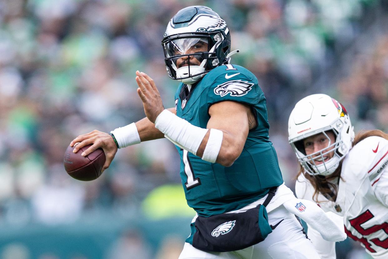 Dec 31, 2023; Philadelphia, Pennsylvania, USA; Philadelphia Eagles quarterback Jalen Hurts (1) passes for a touchdown during the second quarter against the Arizona Cardinals at Lincoln Financial Field. Mandatory Credit: Bill Streicher-USA TODAY Sports